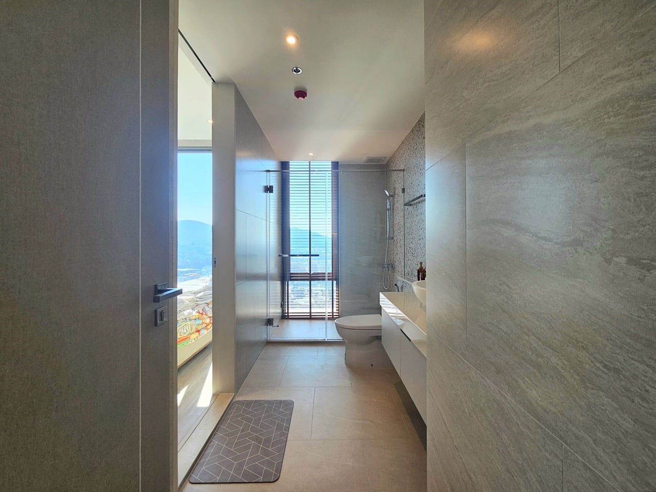 Bathroom corridor leading to bathtub area