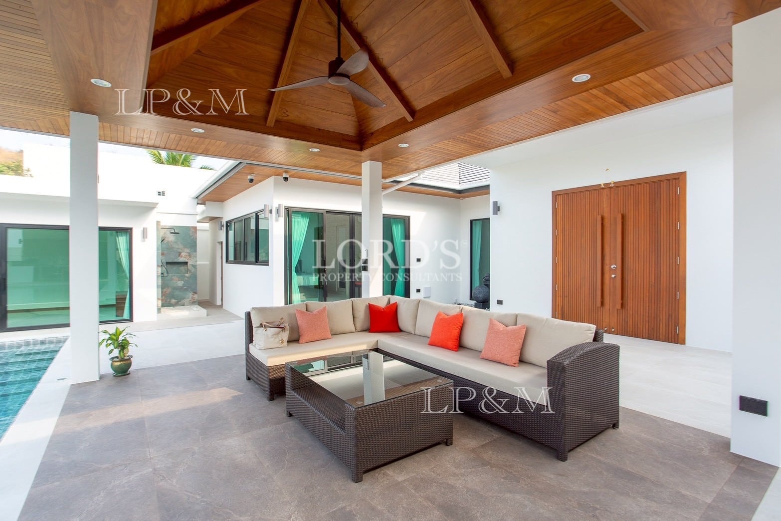 Outdoor lounge area beside pool