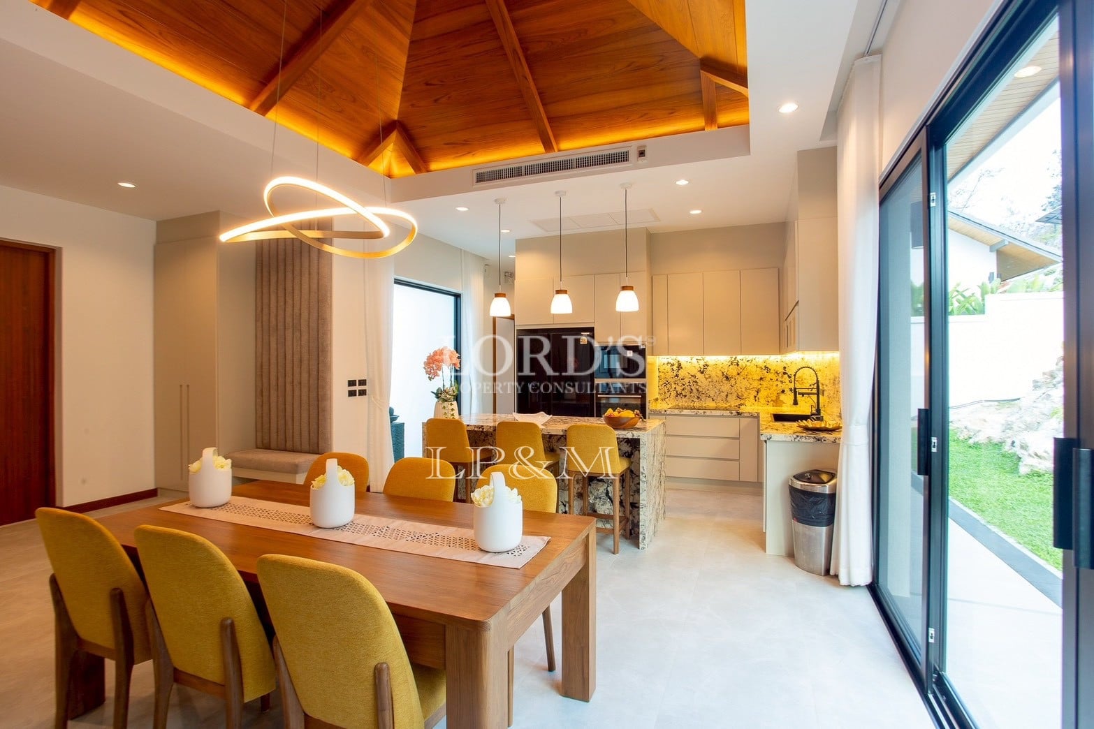 Modern dining area beside kitchen