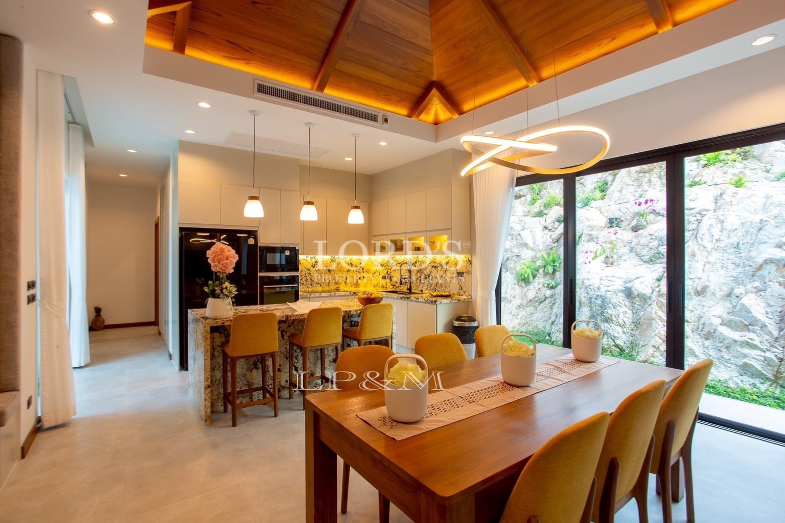 Dining area with wooden ceiling design