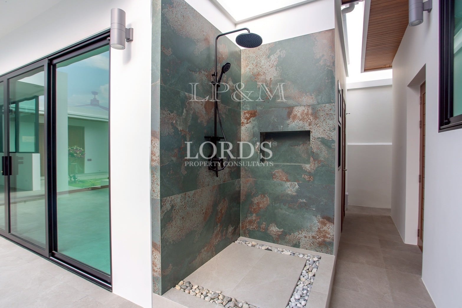 Modern bathroom with patterned shower wall