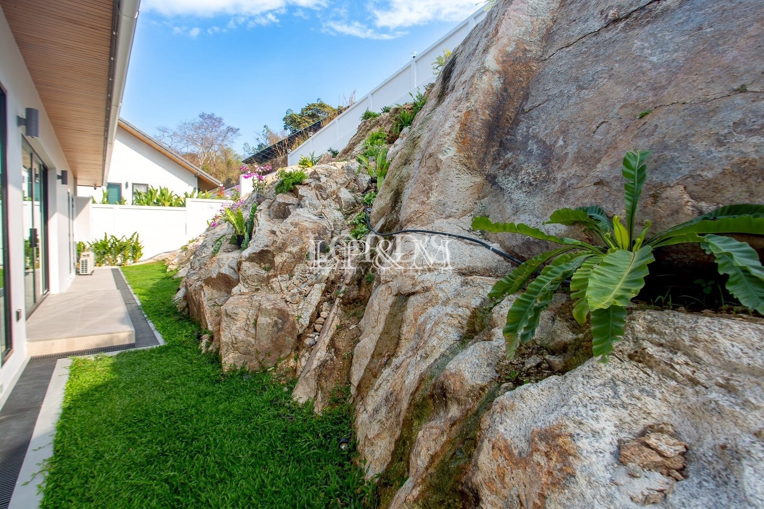 Natural rock garden beside villa