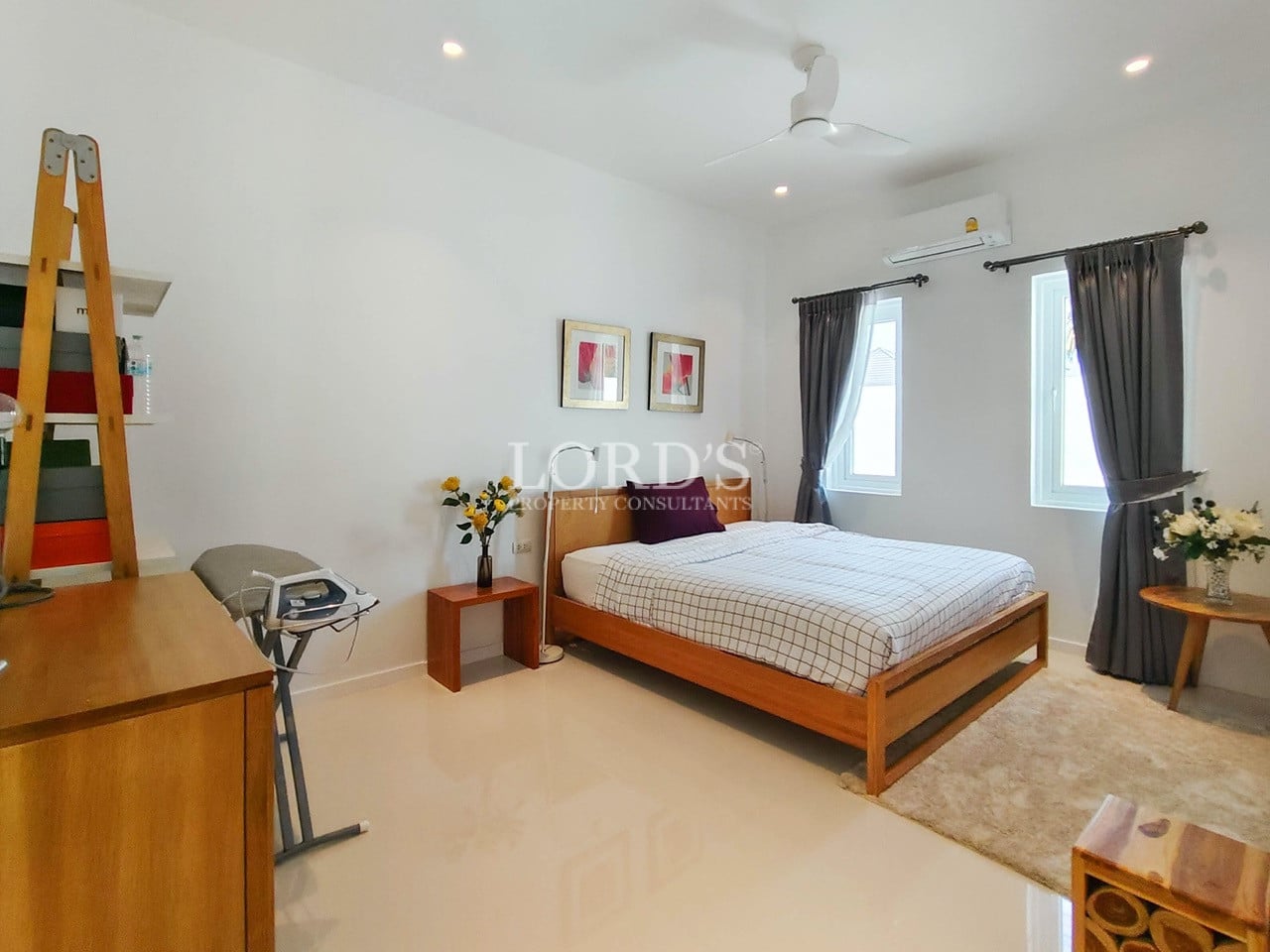 Minimalist bedroom with wooden bed