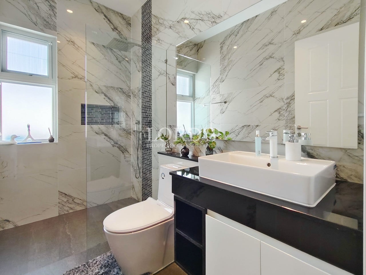 Bathroom with marble wall and vanity sink