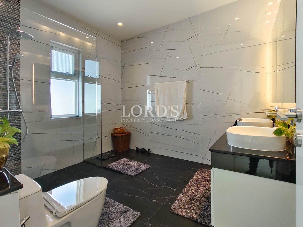 Elegant bathroom with bathtub and marble tiles