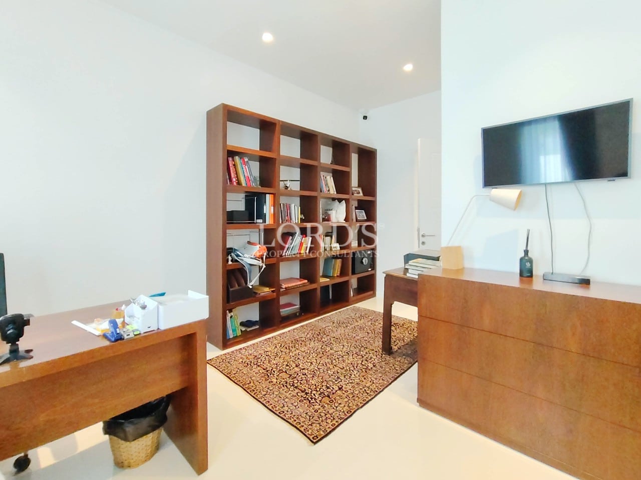 Home office with bookshelf and desk