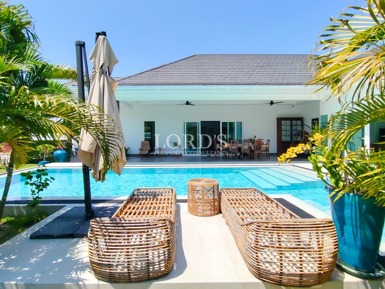 Poolside seating area with outdoor chairs