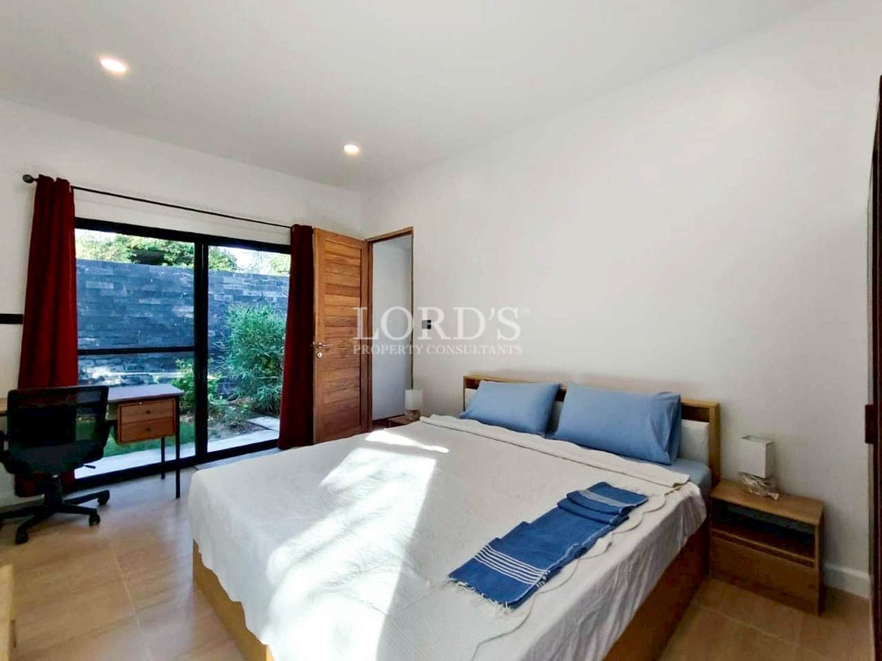 Bedroom with sliding glass door to garden