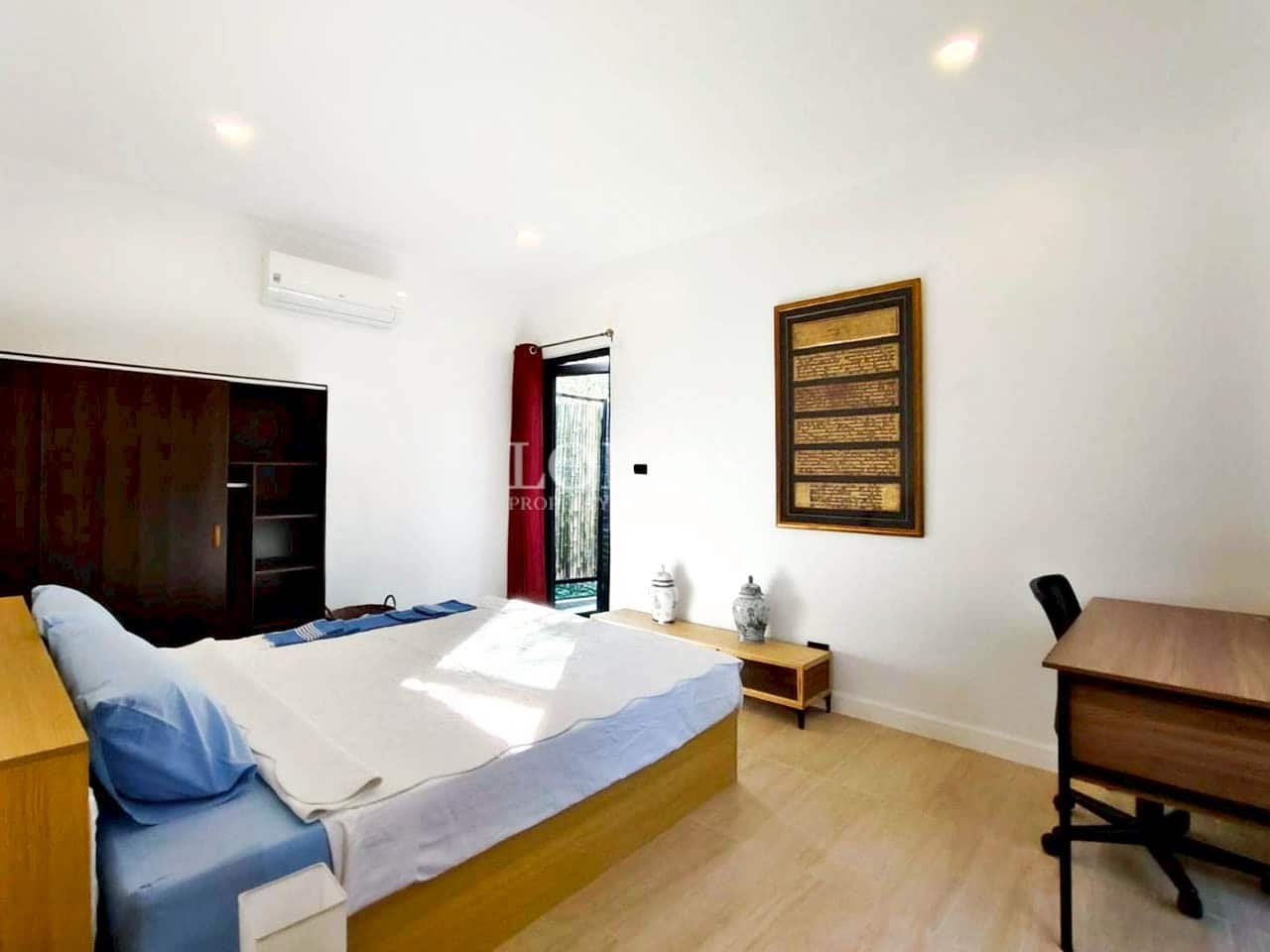 Comfortable bedroom with large bed and soft lighting