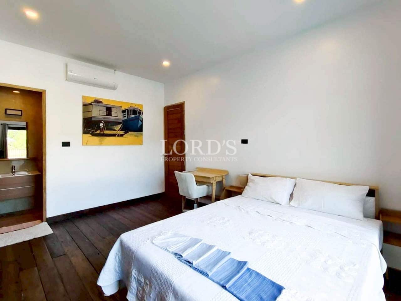 Minimalist bedroom with simple white interior