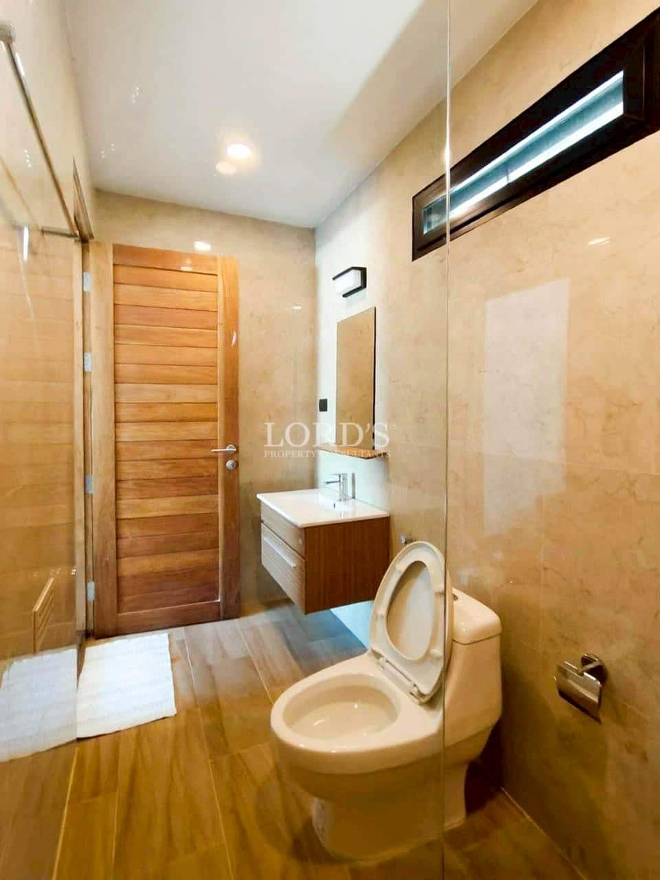Bathroom with shower and wooden door design