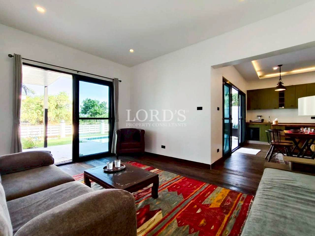Modern living room with large windows and natural light