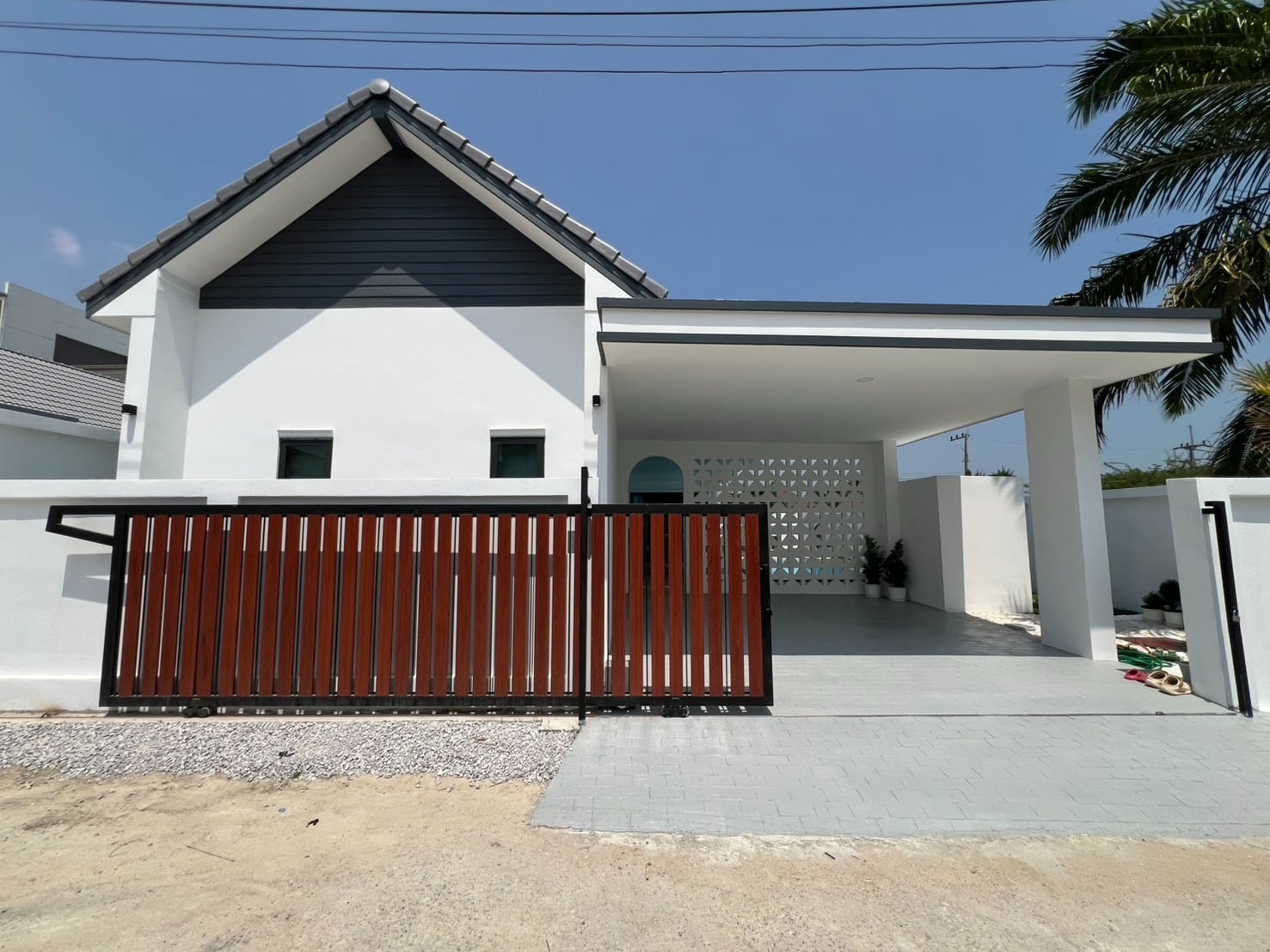 Modern house exterior with gate and driveway