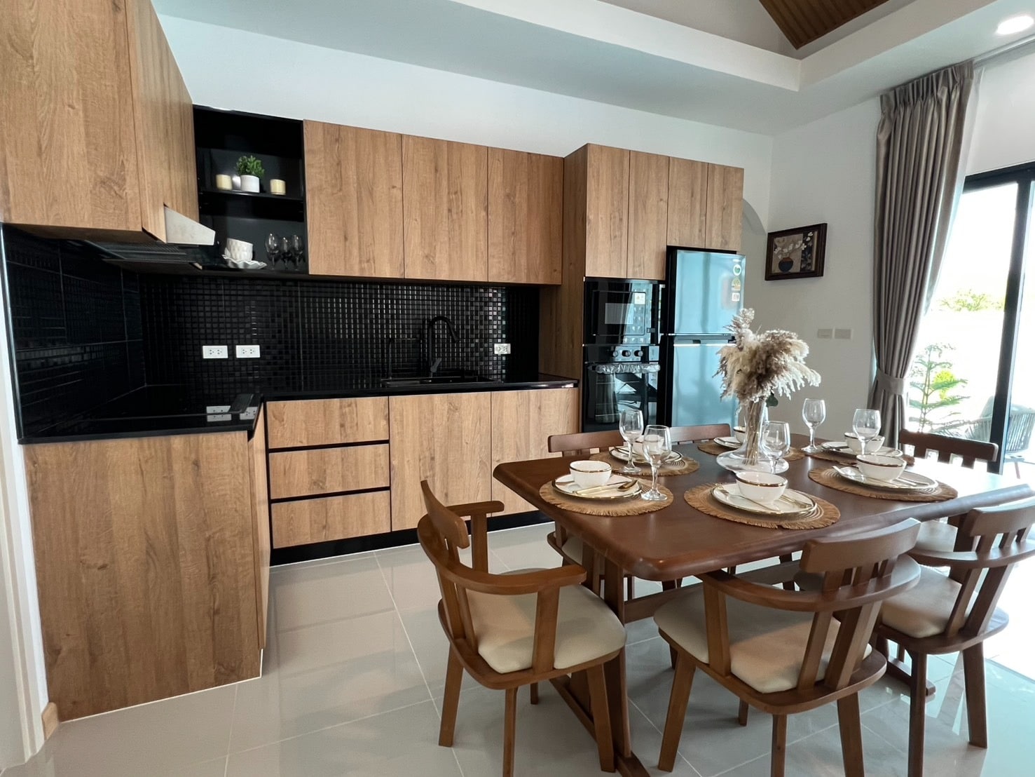Modern kitchen with wooden cabinets and dining table