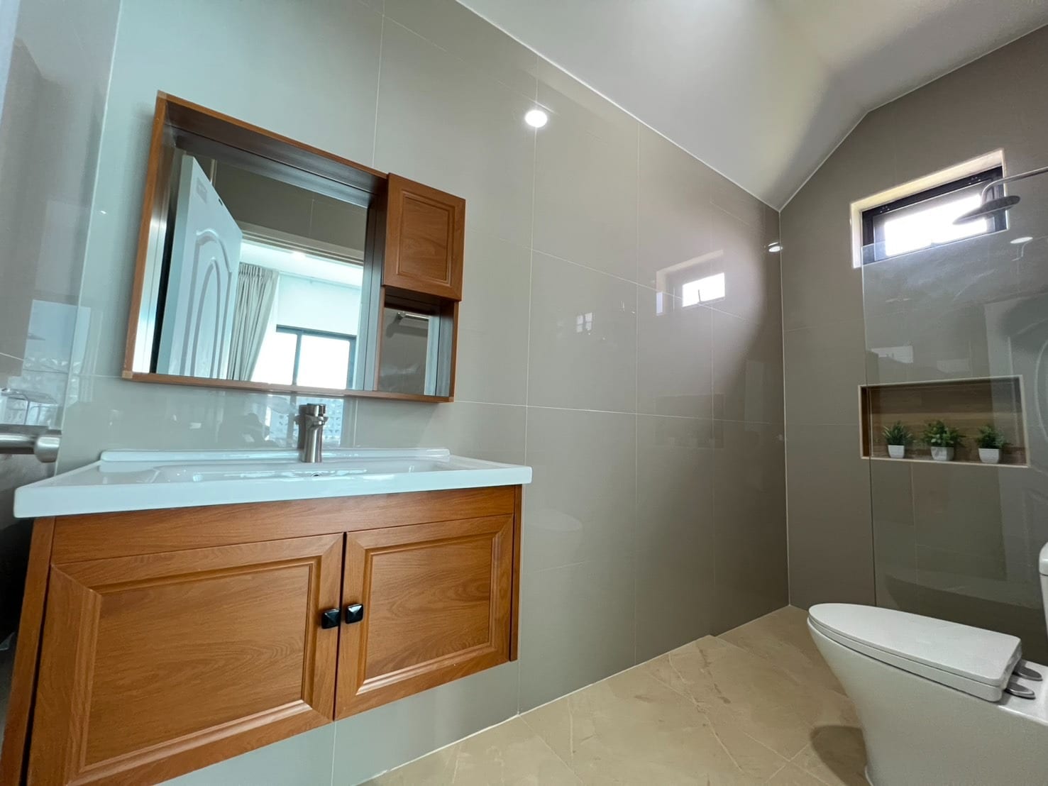 Bathroom with wooden cabinet and sink