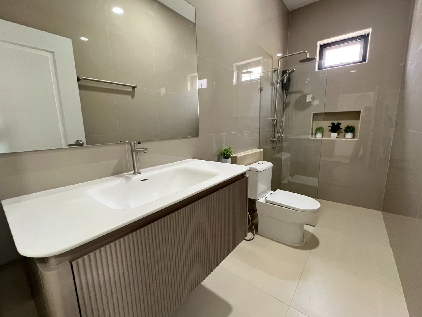 Bathroom with long vanity and mirror