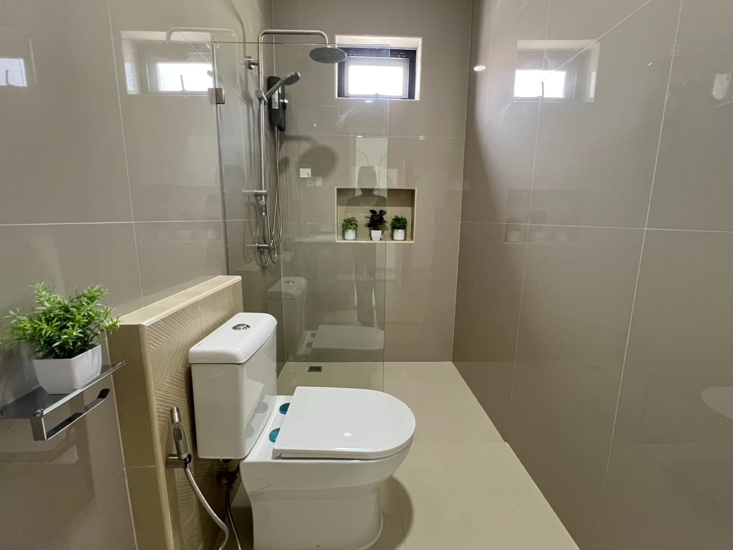 Compact bathroom with toilet and shower