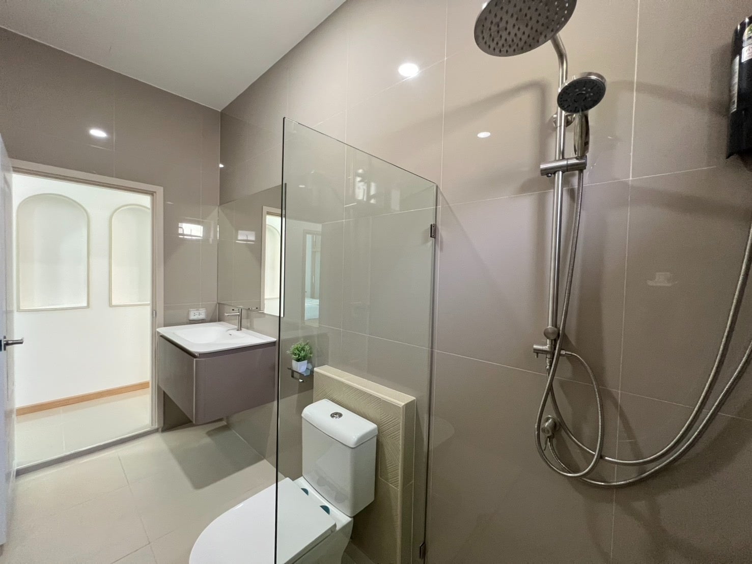 Bathroom with shower and glass partition