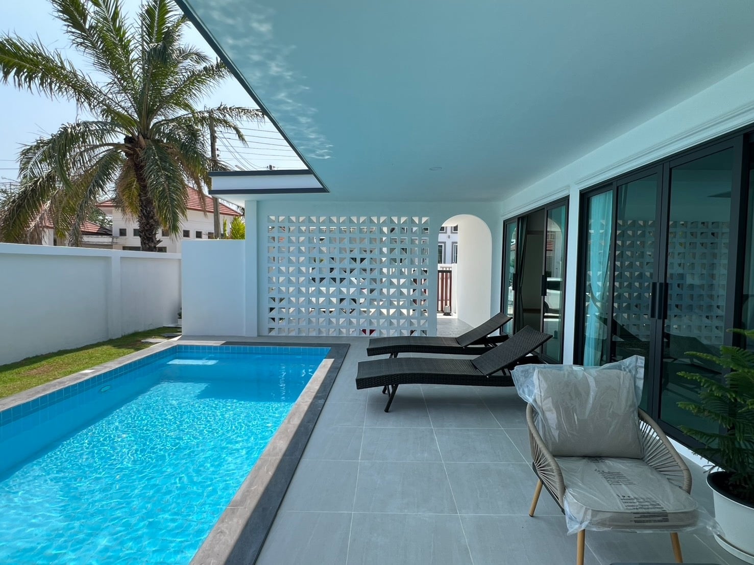 Modern pool area with sunbeds