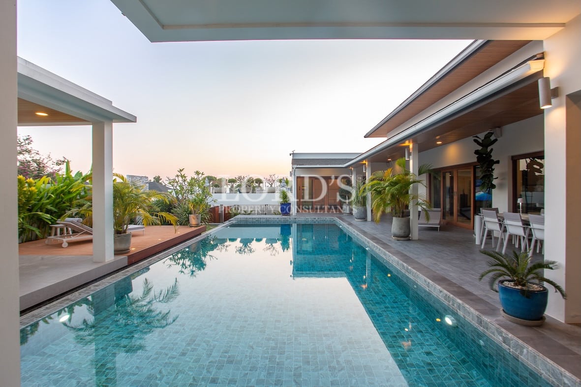 Swimming pool with villa exterior view