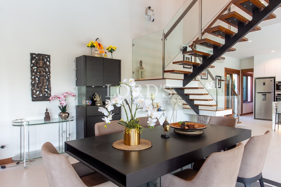 Dining table with decor and staircase view