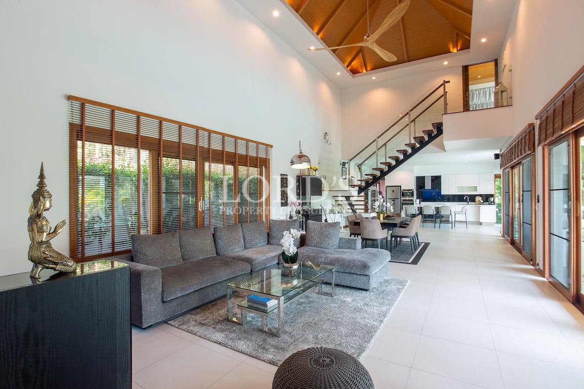 Living room with staircase and sofa set