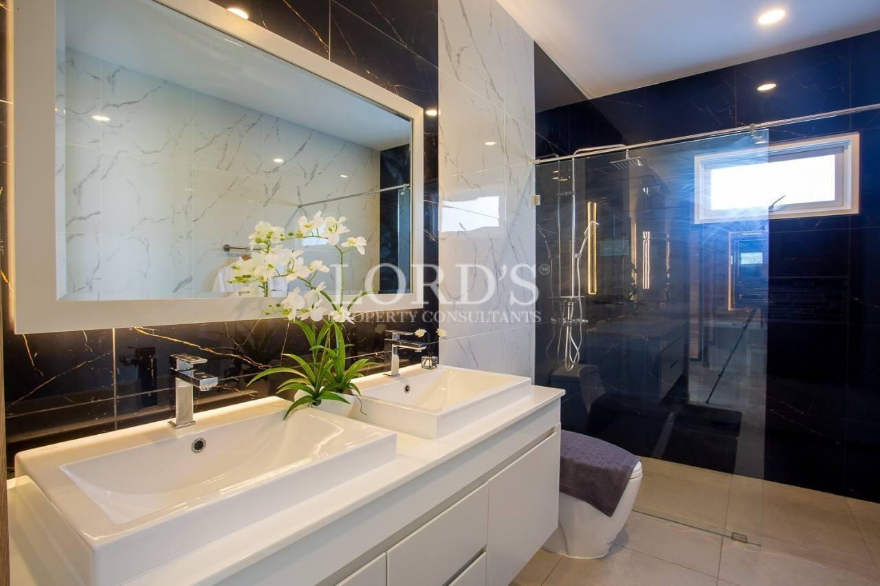 108 Bathroom with double sink and large mirror