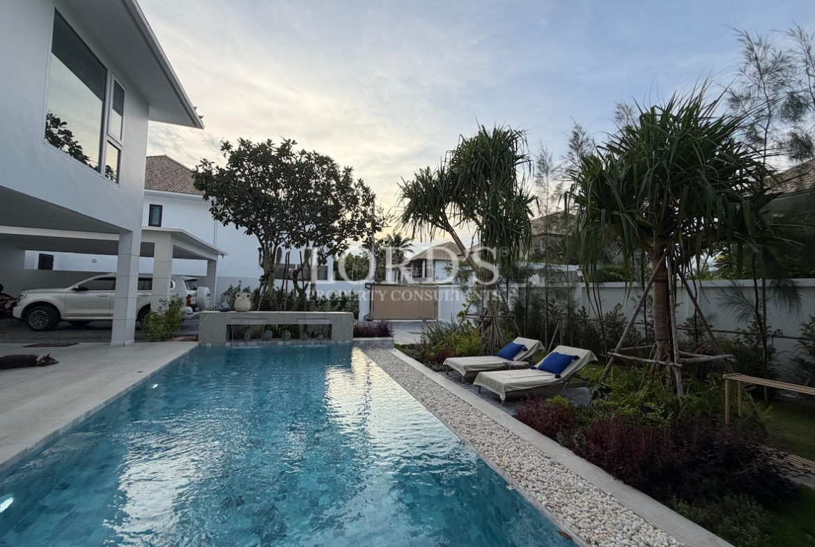 Pool with villa and garden