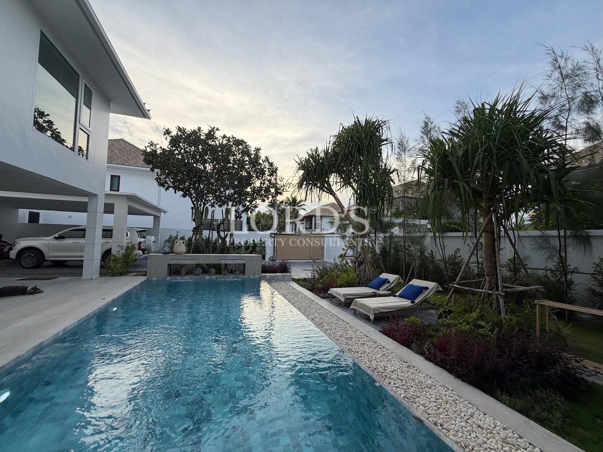 Pool with villa and garden