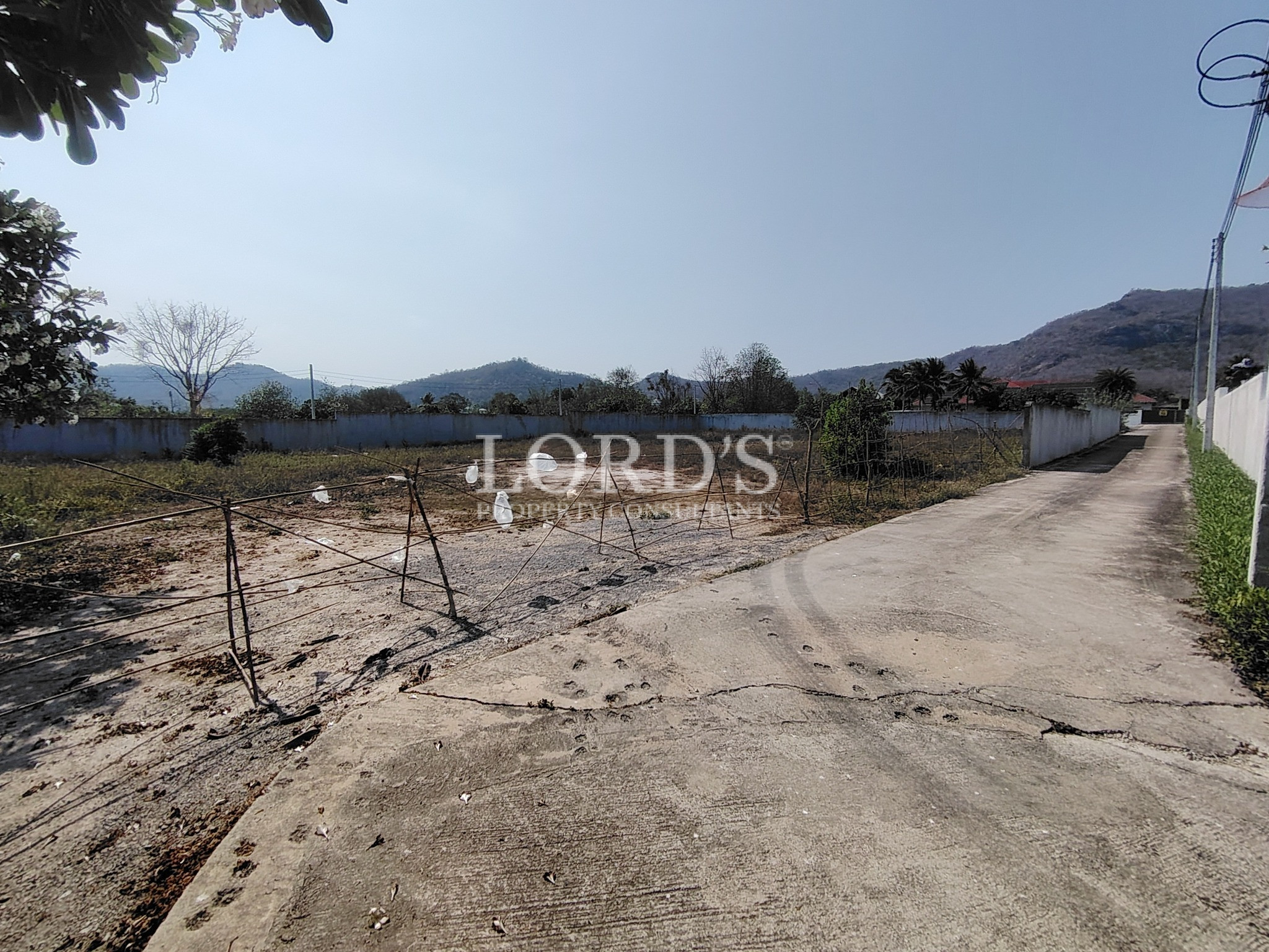 Unpaved road near land plot area