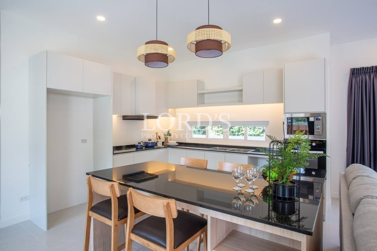120 Kitchen with dining table and pendant lights