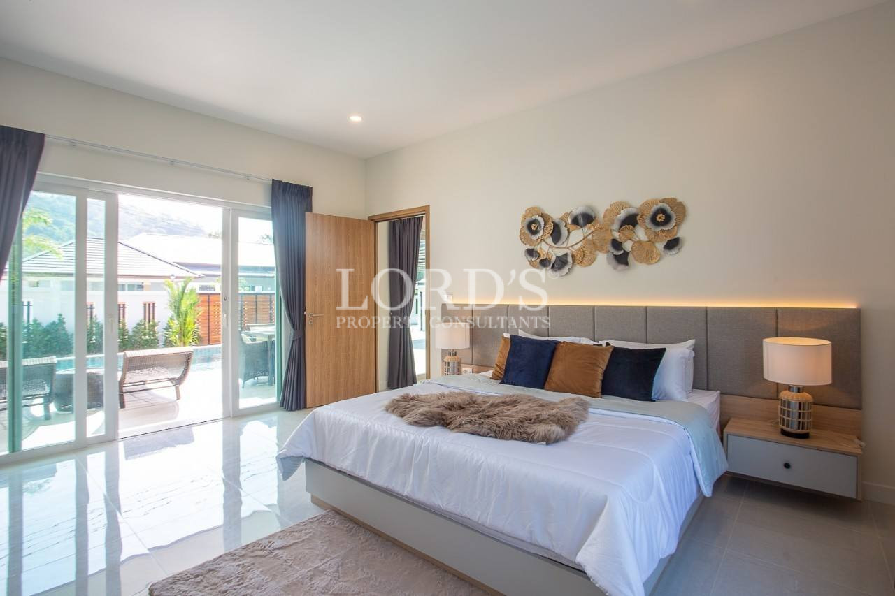 122 Bedroom with sliding doors and outdoor view