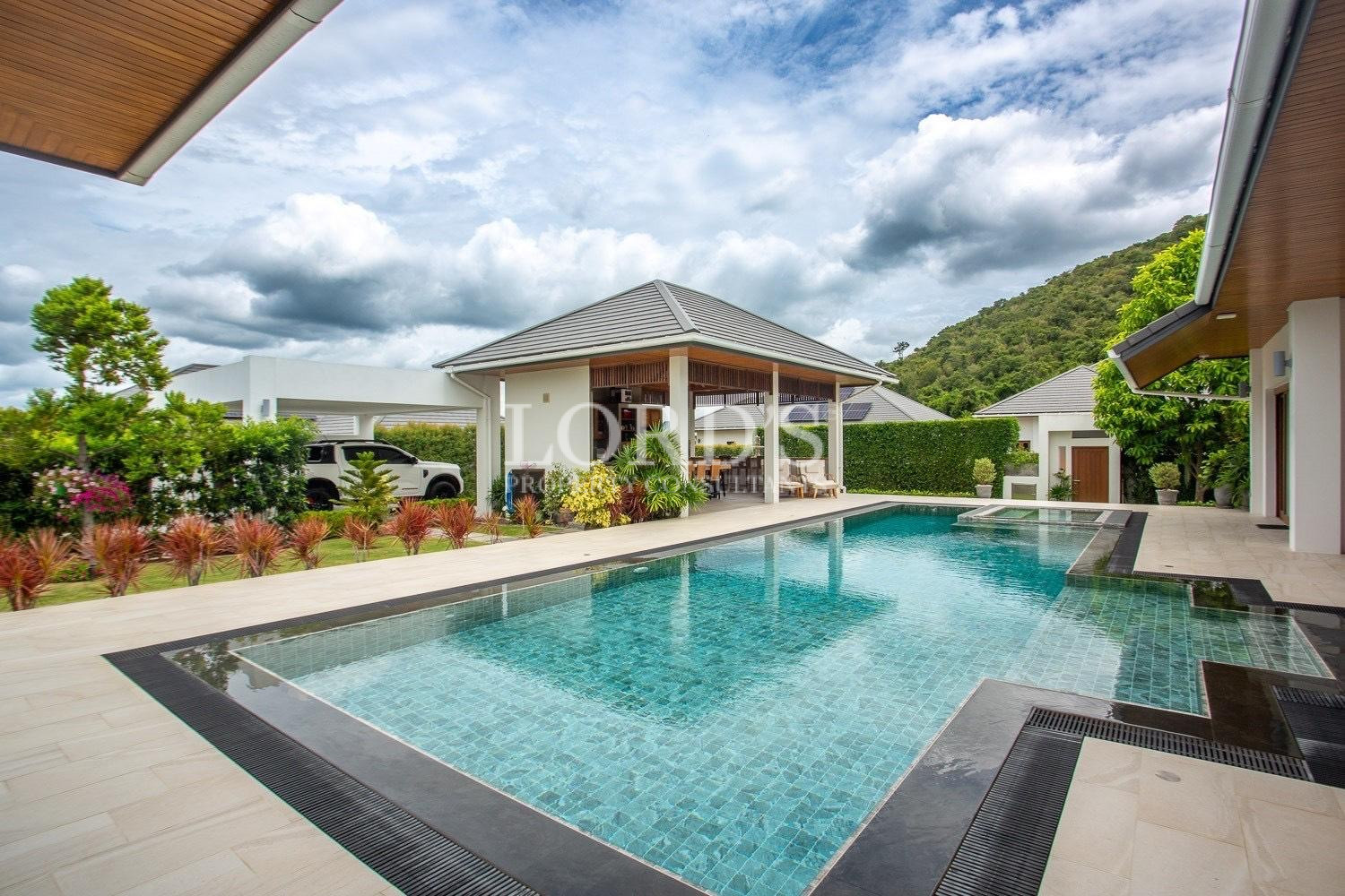 Swimming pool beside modern house