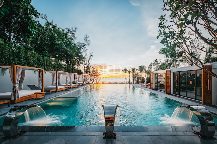 Resort-style infinity pool with sunset view