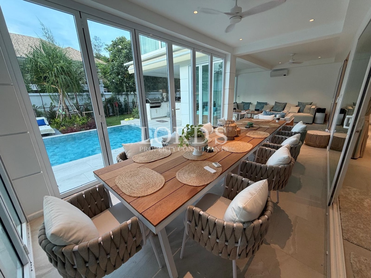 Dining area with table near pool
