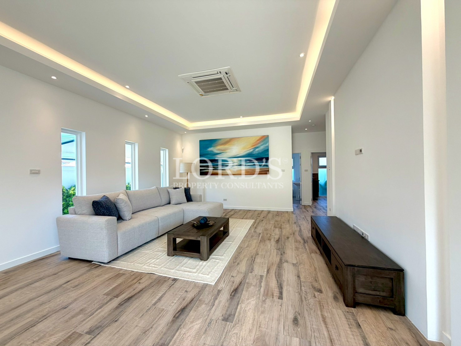 Beautiful open living room with LED ceiling