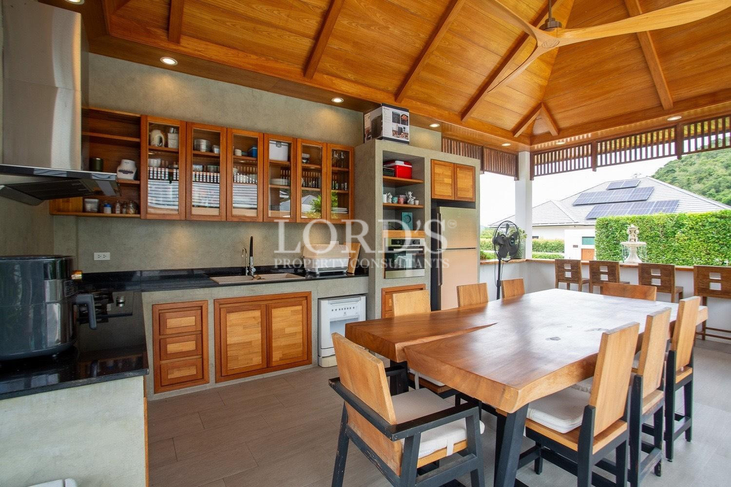 Outdoor kitchen with wooden cabinets