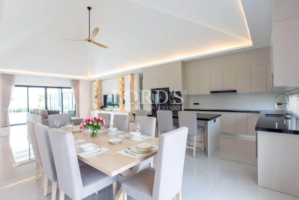 Open-plan dining area and modern kitchen in villa