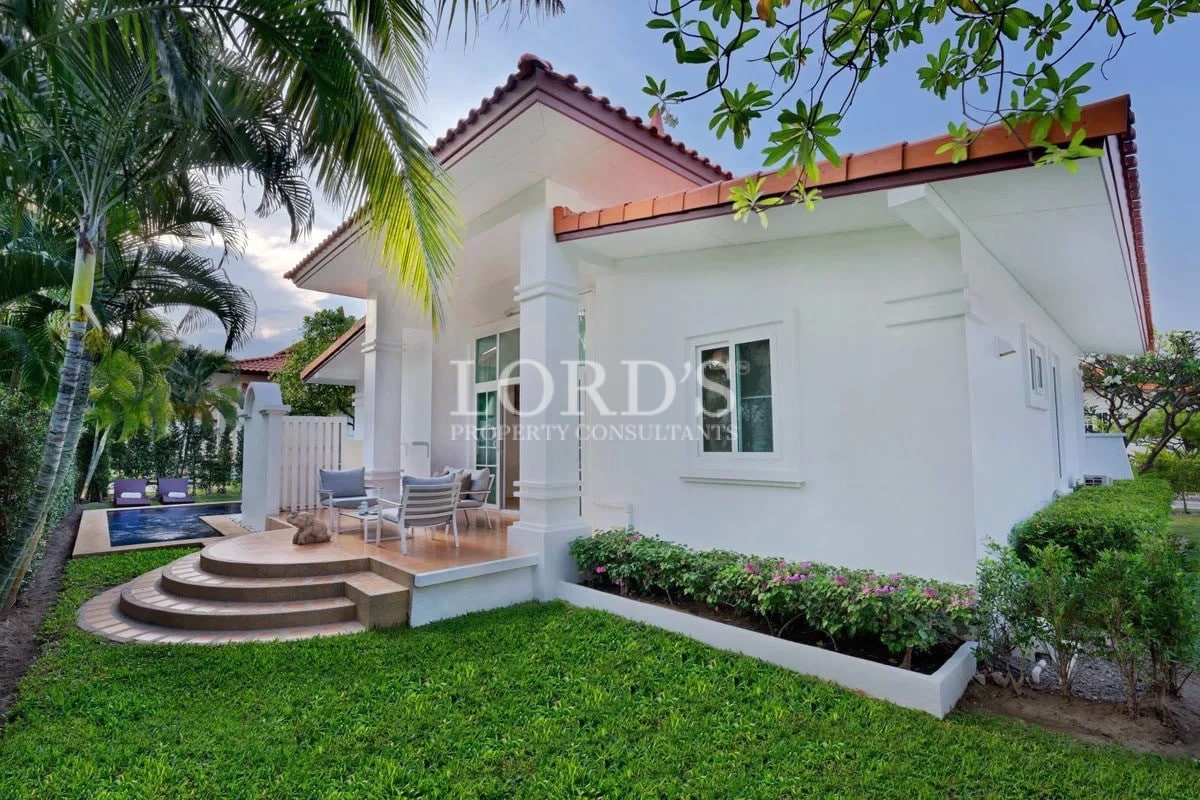 House exterior with garden lawn