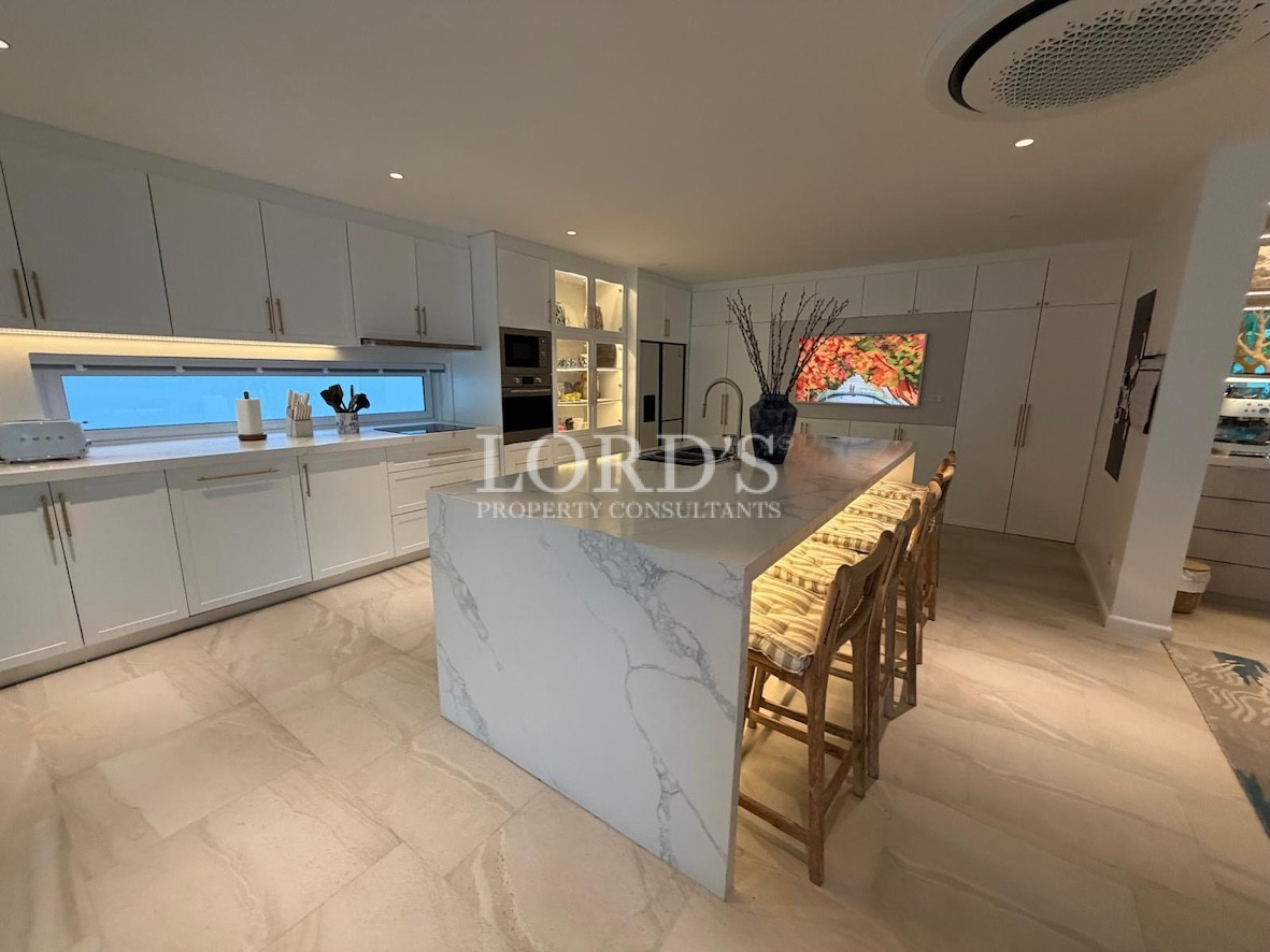 Kitchen with island and bar stools