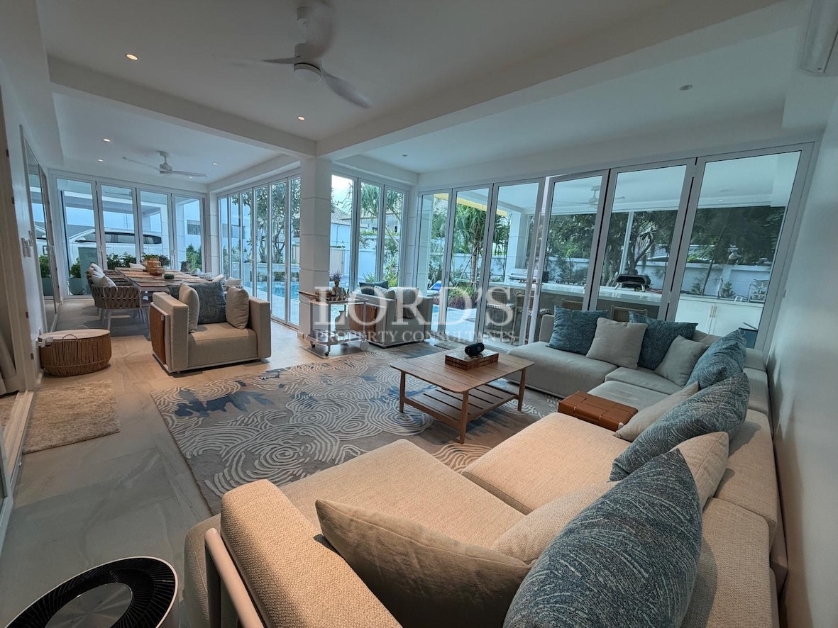 Living room with large sofa and lighting