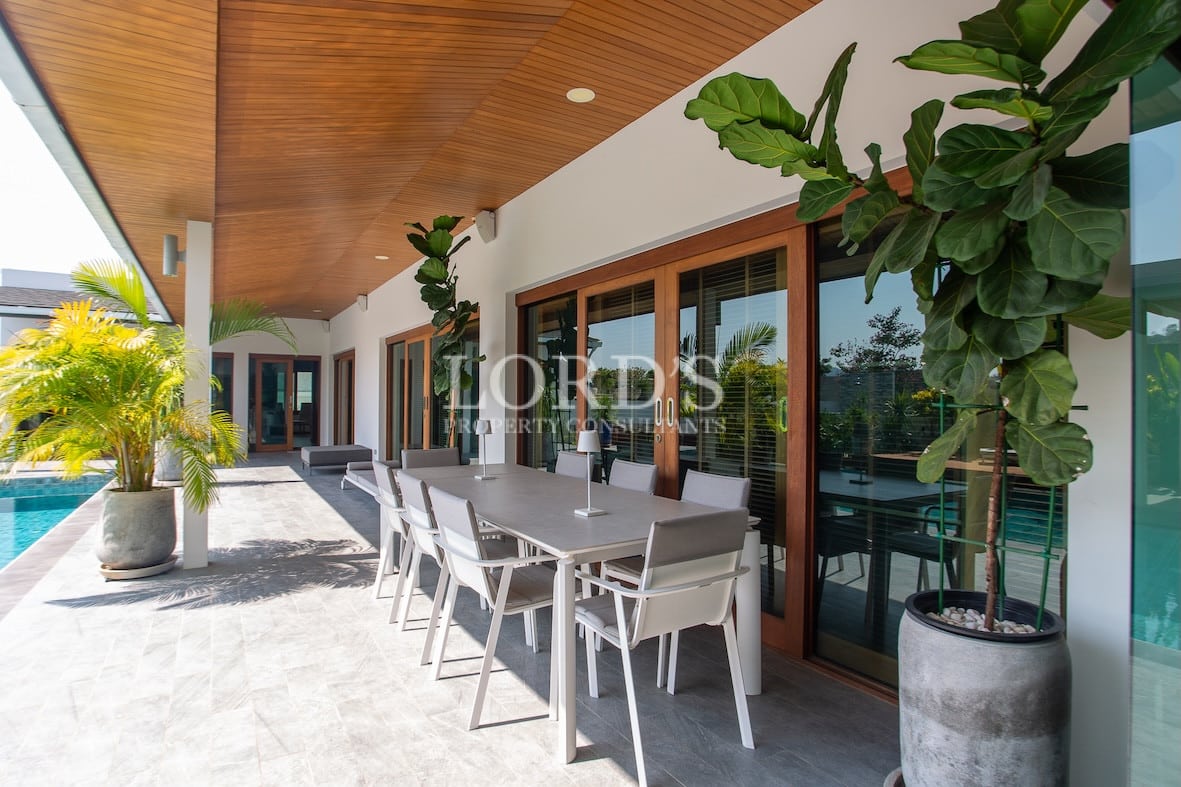Poolside seating area with shade