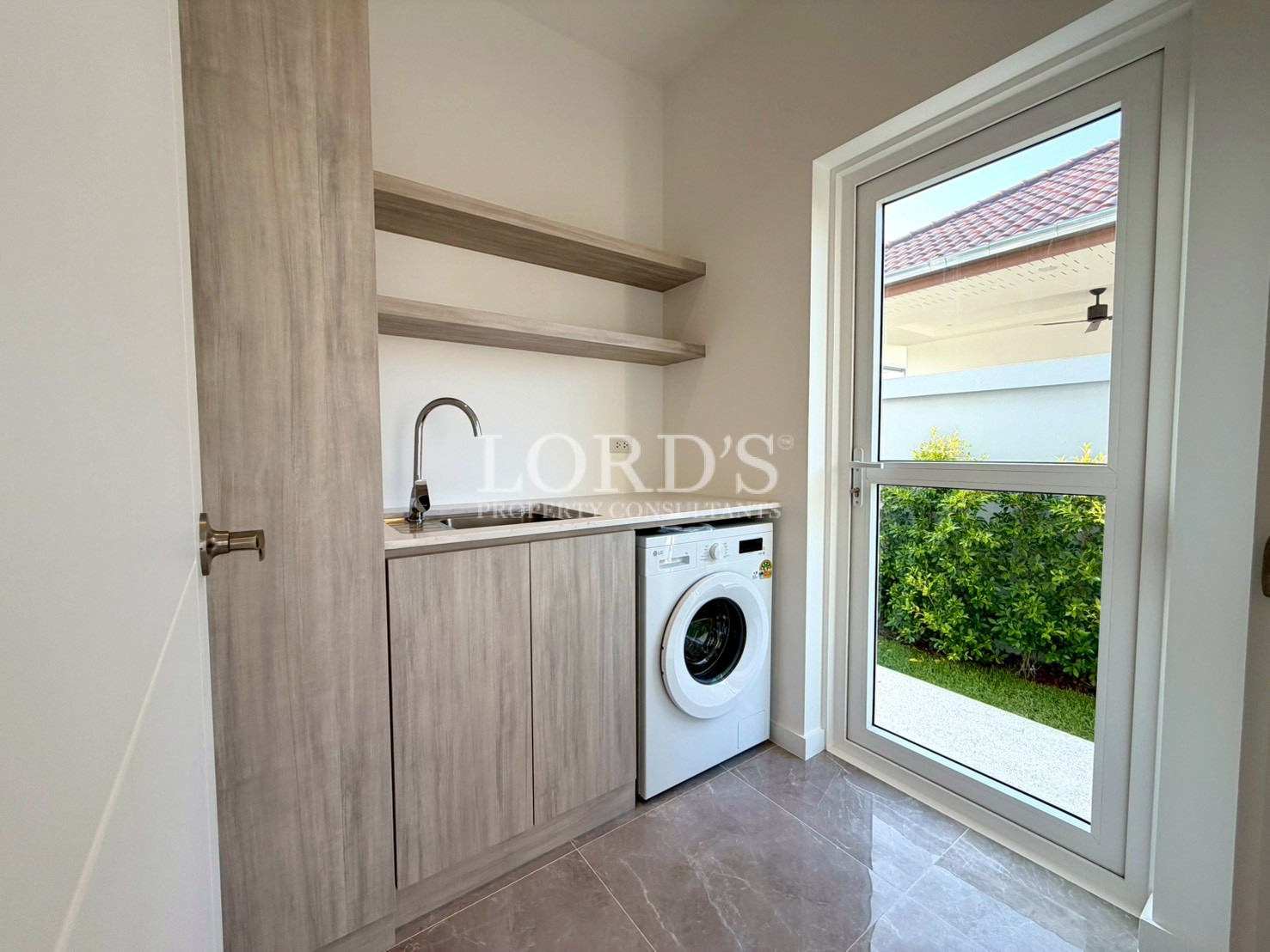 Beautiful laundry room with storage