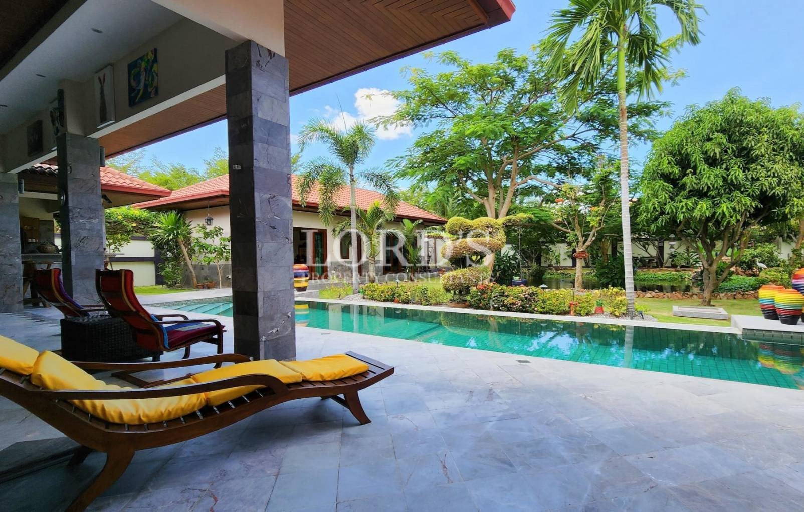 Poolside terrace with lounge chairs