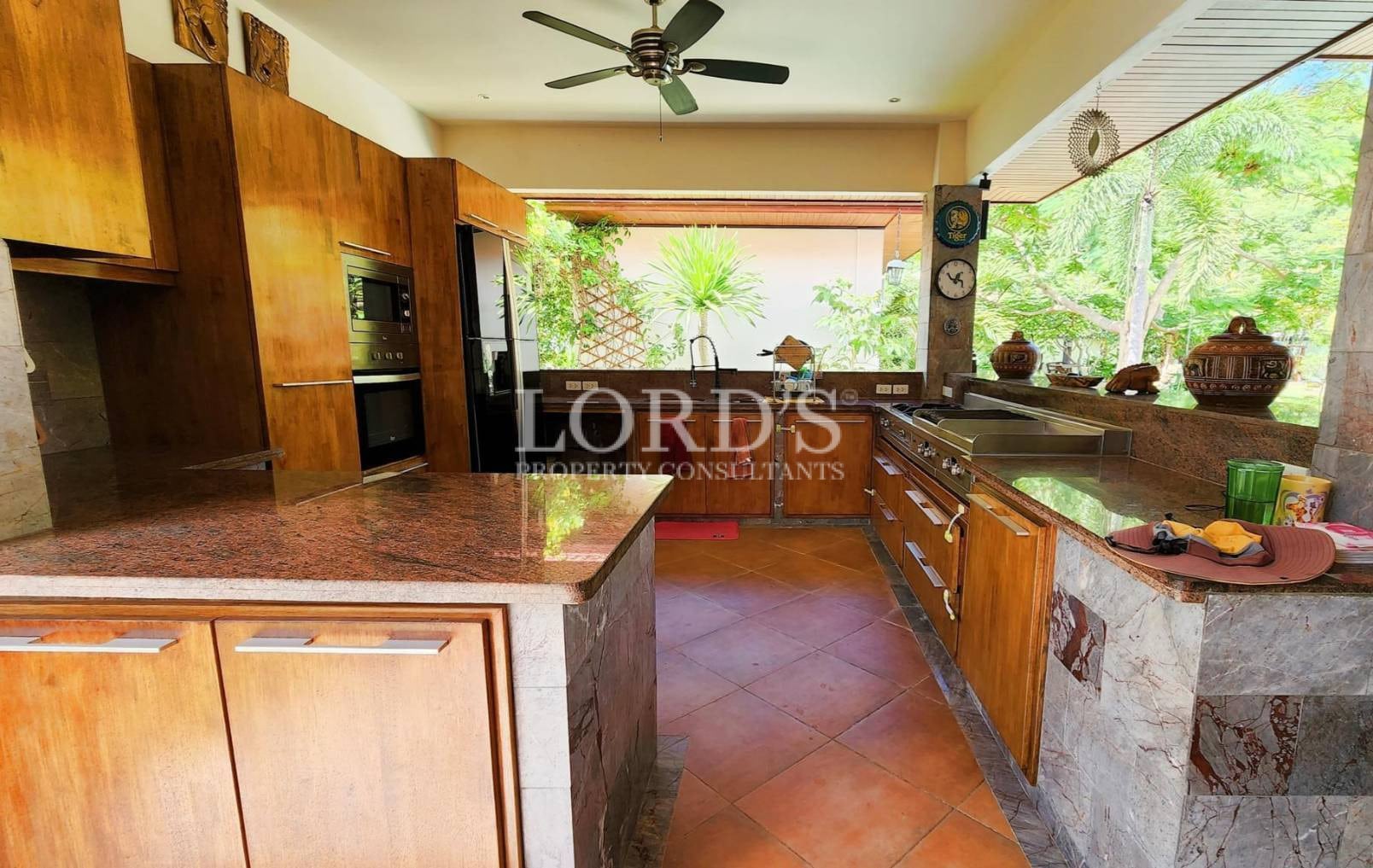 Kitchen with wooden cabinets and open layout