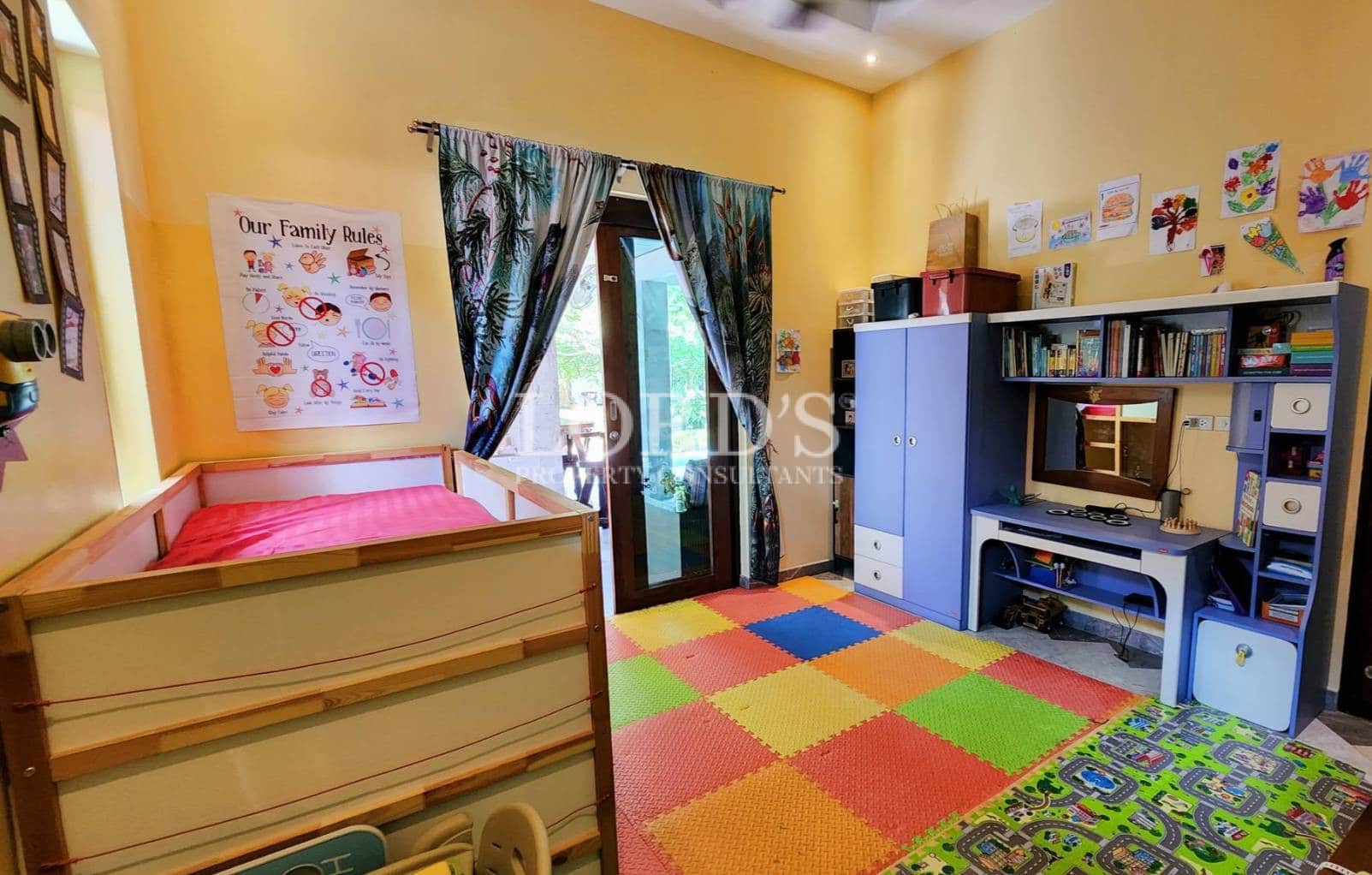 Bedroom with colorful rug and study desk