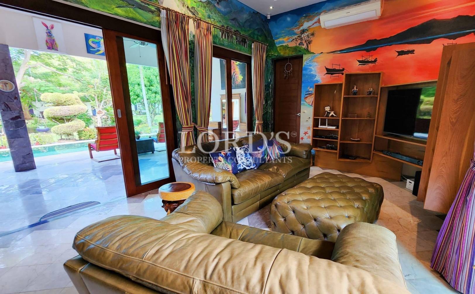 Bedroom with colorful bedding and wall mural