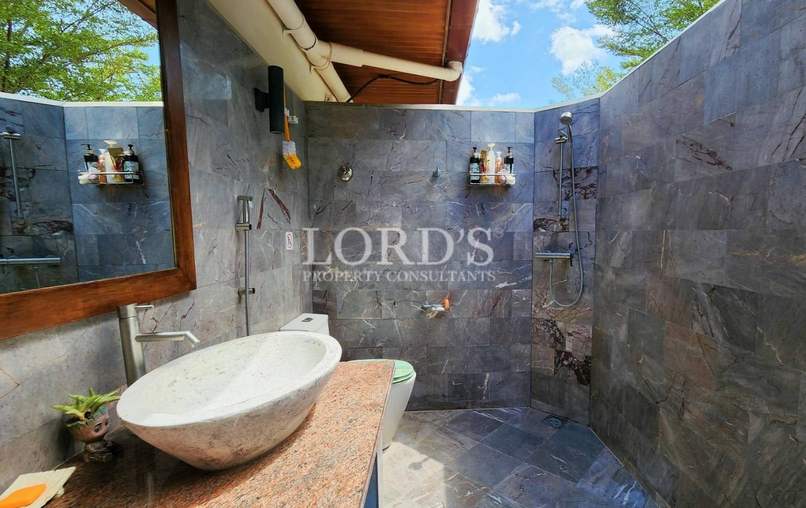 Bathroom with stone walls and sink