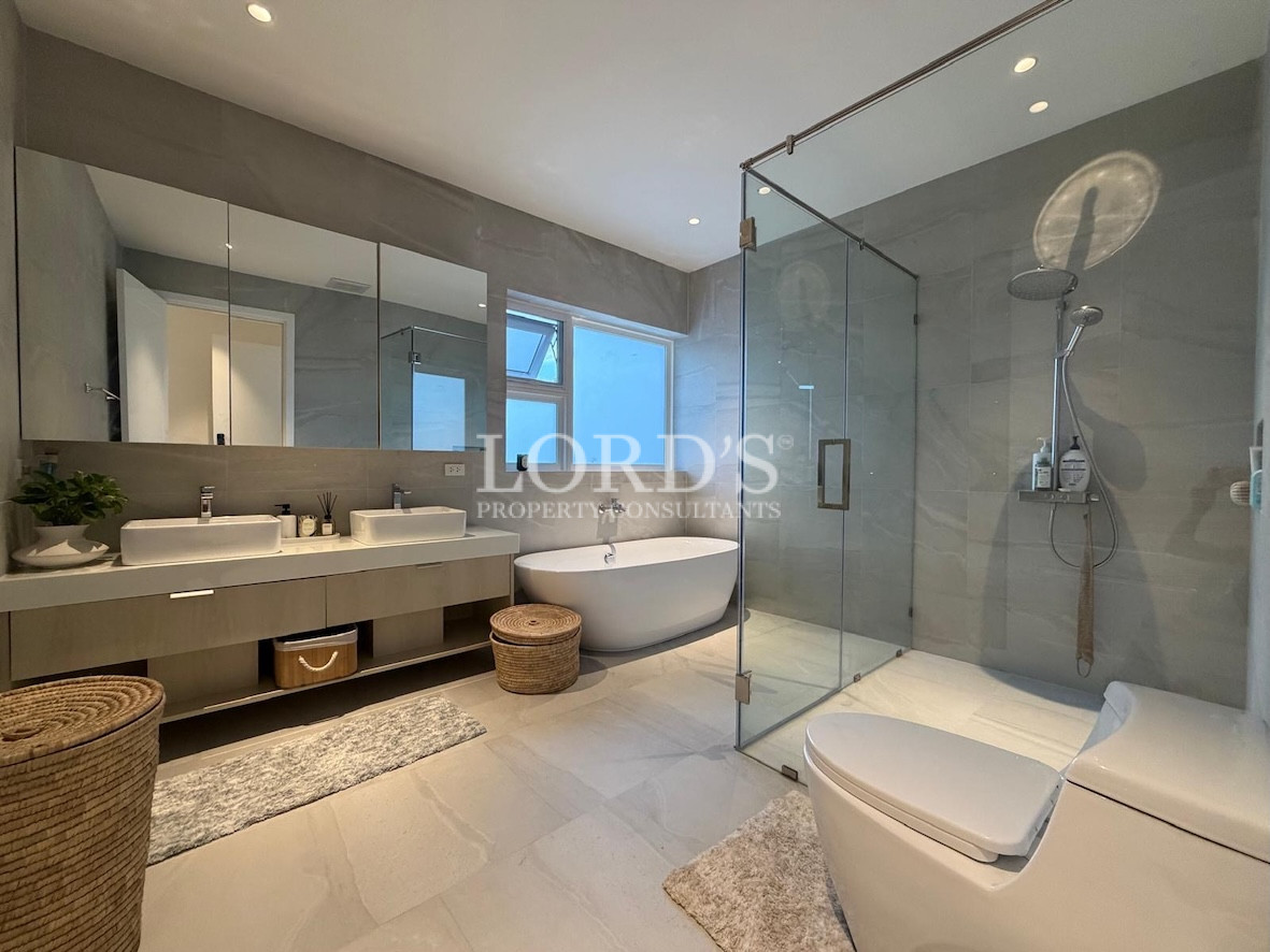 Bathroom with glass shower and tub