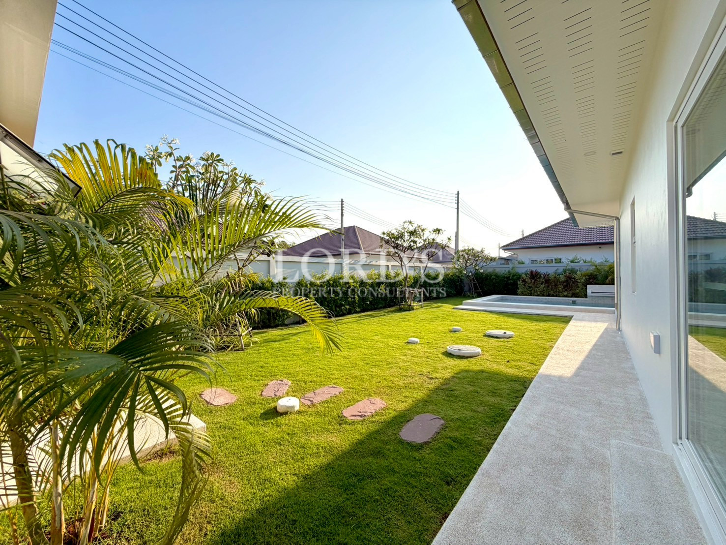 Beautiful garden walkway beside modern house